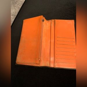 Chanel chocolate brown wallet.  There’s wear on the inside and outside.